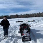 ice fishing in front of dobiesnorthwoodscottages